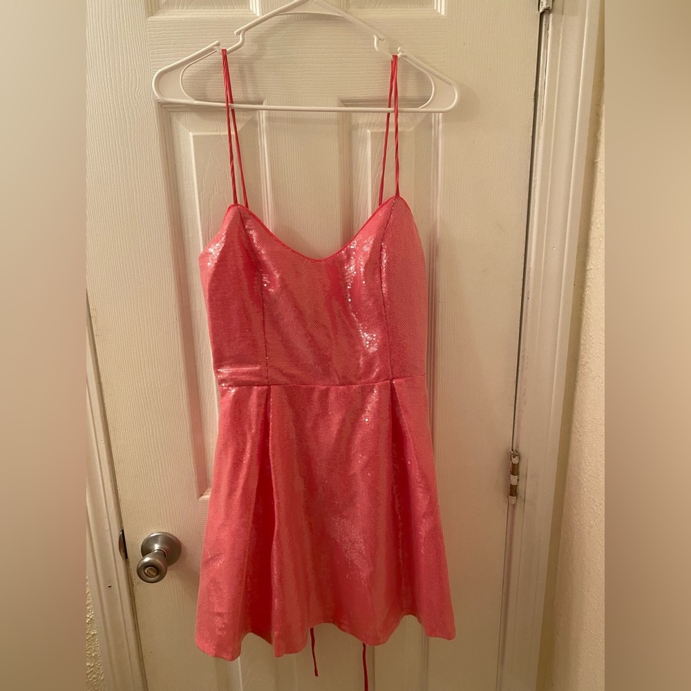 Pink fashion nova dress. Says large but fits medium.